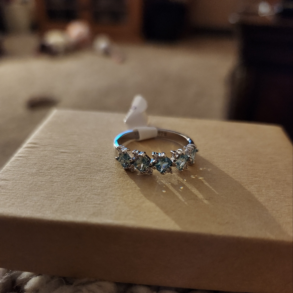 Aquamarine and cubic zirconia ring